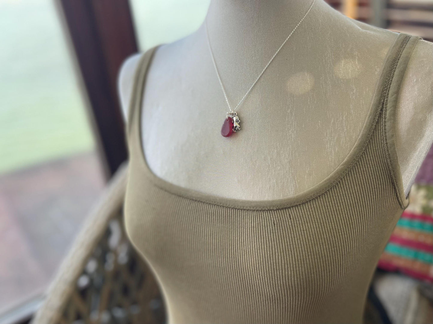 Eco friendly sea glass necklace on a sterling silver chain showcasing a little octopus. Octopus pendant, octopus necklace, ethical jewellery