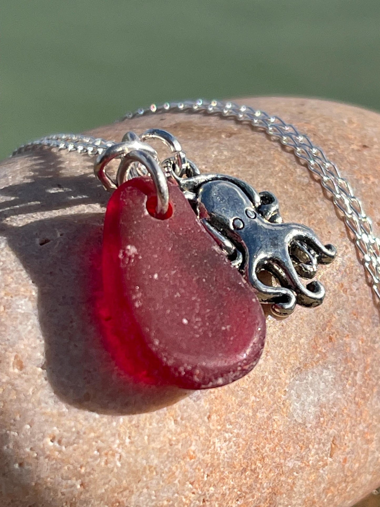 Eco friendly sea glass necklace on a sterling silver chain showcasing a little octopus. Octopus pendant, octopus necklace, ethical jewellery
