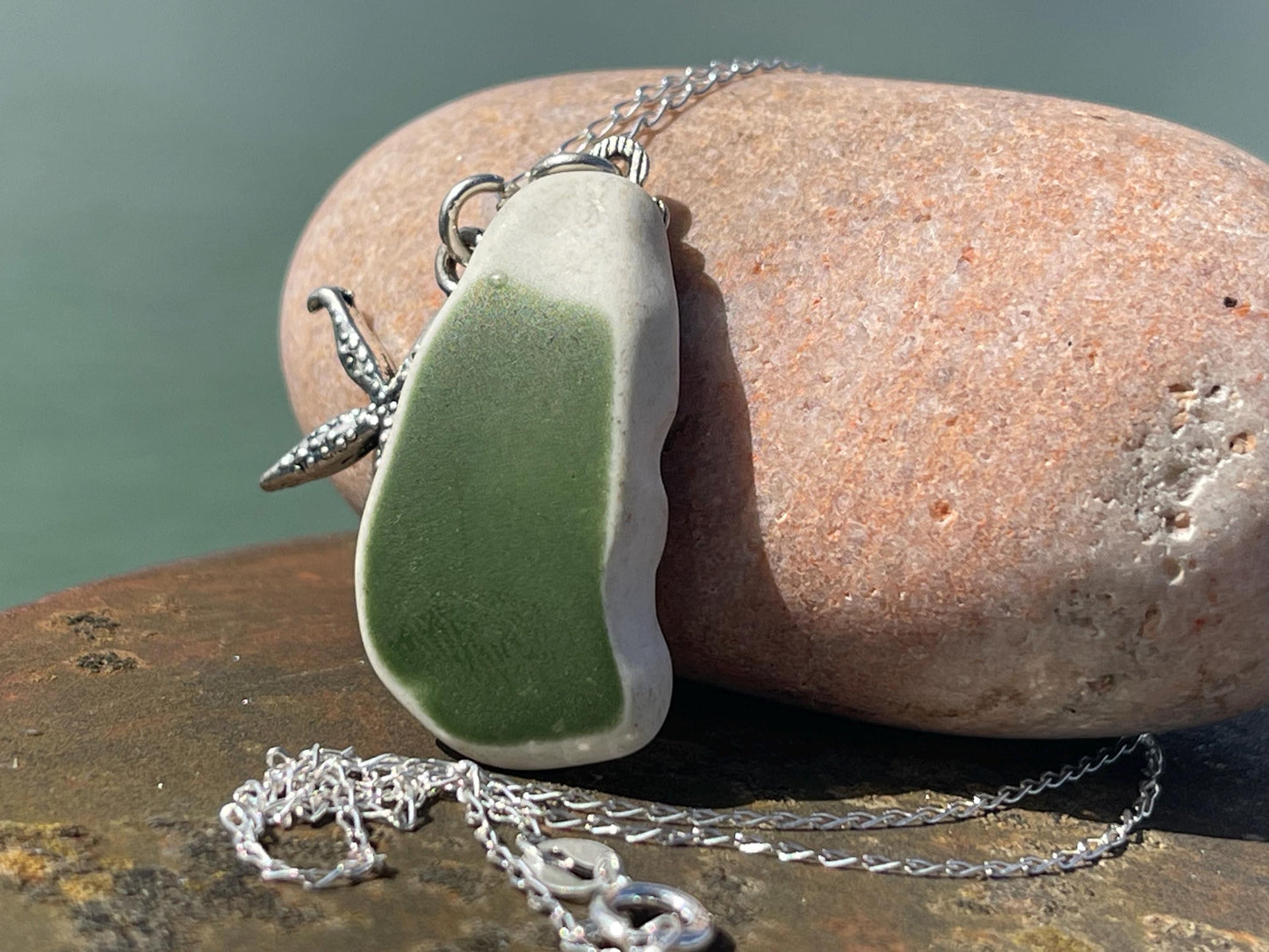 Eco friendly sea ceramic necklace on a sterling silver chain showcasing a little starfish pendant, starfish necklace, ethical jewellery