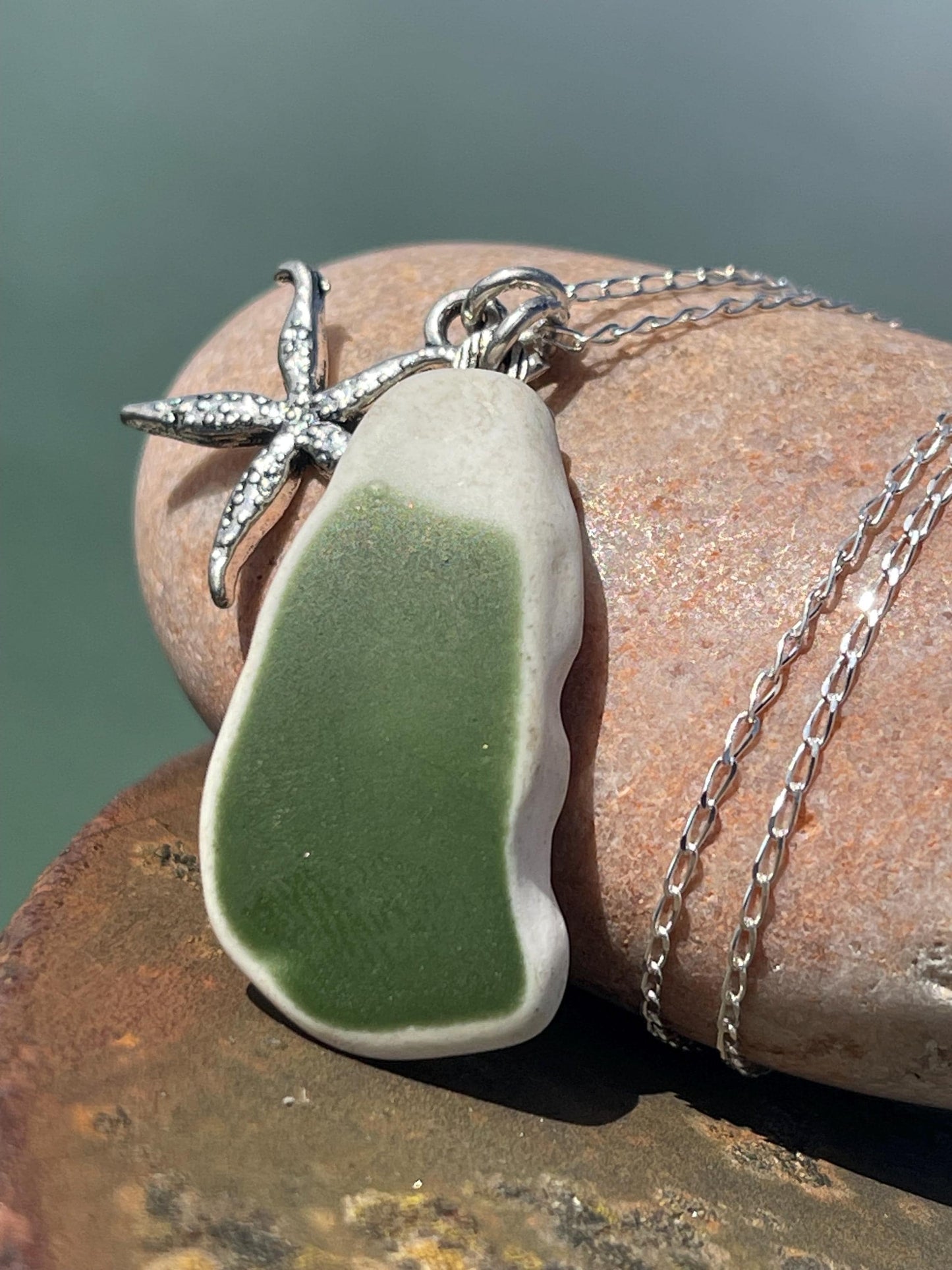 Eco friendly sea ceramic necklace on a sterling silver chain showcasing a little starfish pendant, starfish necklace, ethical jewellery