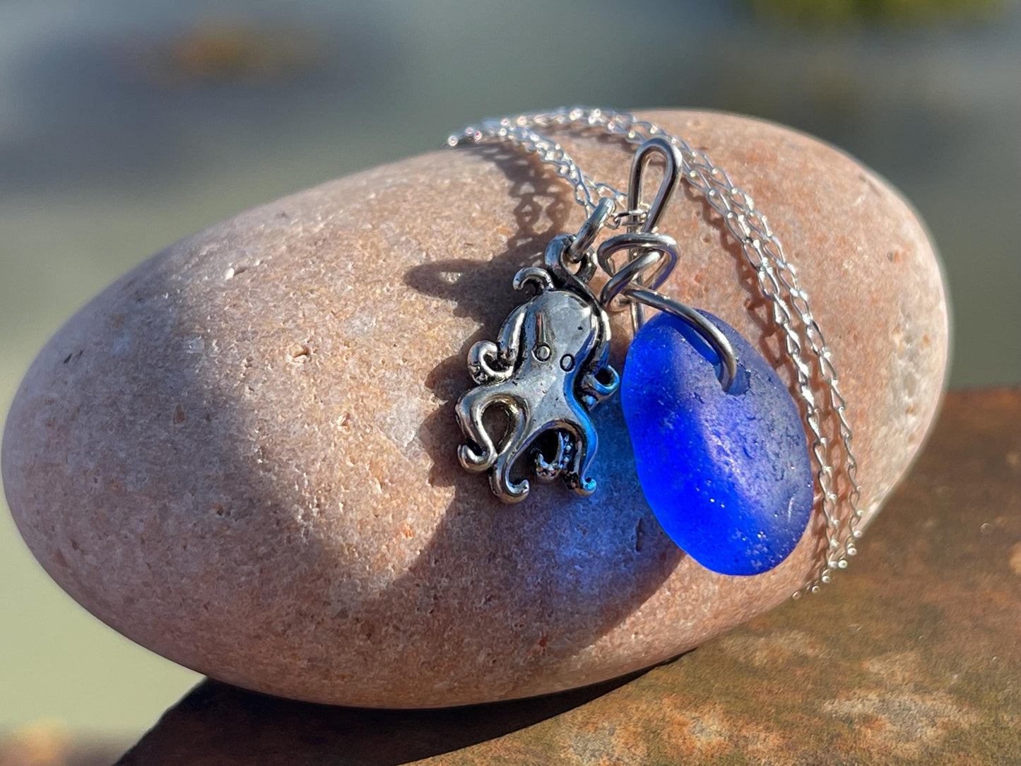 Eco friendly sea glass necklace on a sterling silver chain showcasing a little octopus. Octopus pendant, octopus necklace, ethical jewellery