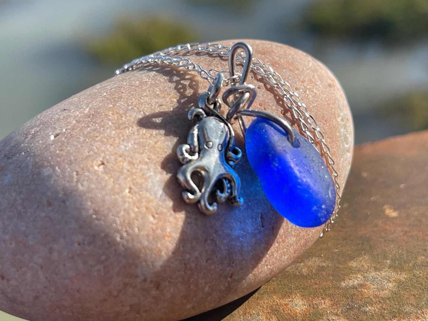 Eco friendly sea glass necklace on a sterling silver chain showcasing a little octopus. Octopus pendant, octopus necklace, ethical jewellery