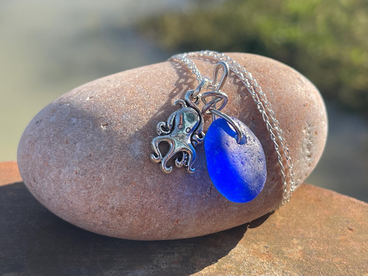 Eco friendly sea glass necklace on a sterling silver chain showcasing a little octopus. Octopus pendant, octopus necklace, ethical jewellery