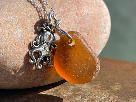 Eco friendly sea glass necklace on a sterling silver chain showcasing a little octopus. Octopus pendant, octopus necklace, ethical jewellery