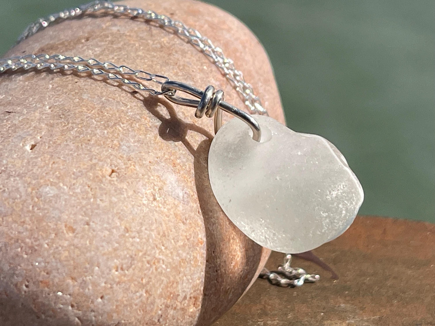 Eco friendly sea glass necklace on a sterling silver chain showcasing a little octopus. Octopus pendant, octopus necklace, ethical jewellery