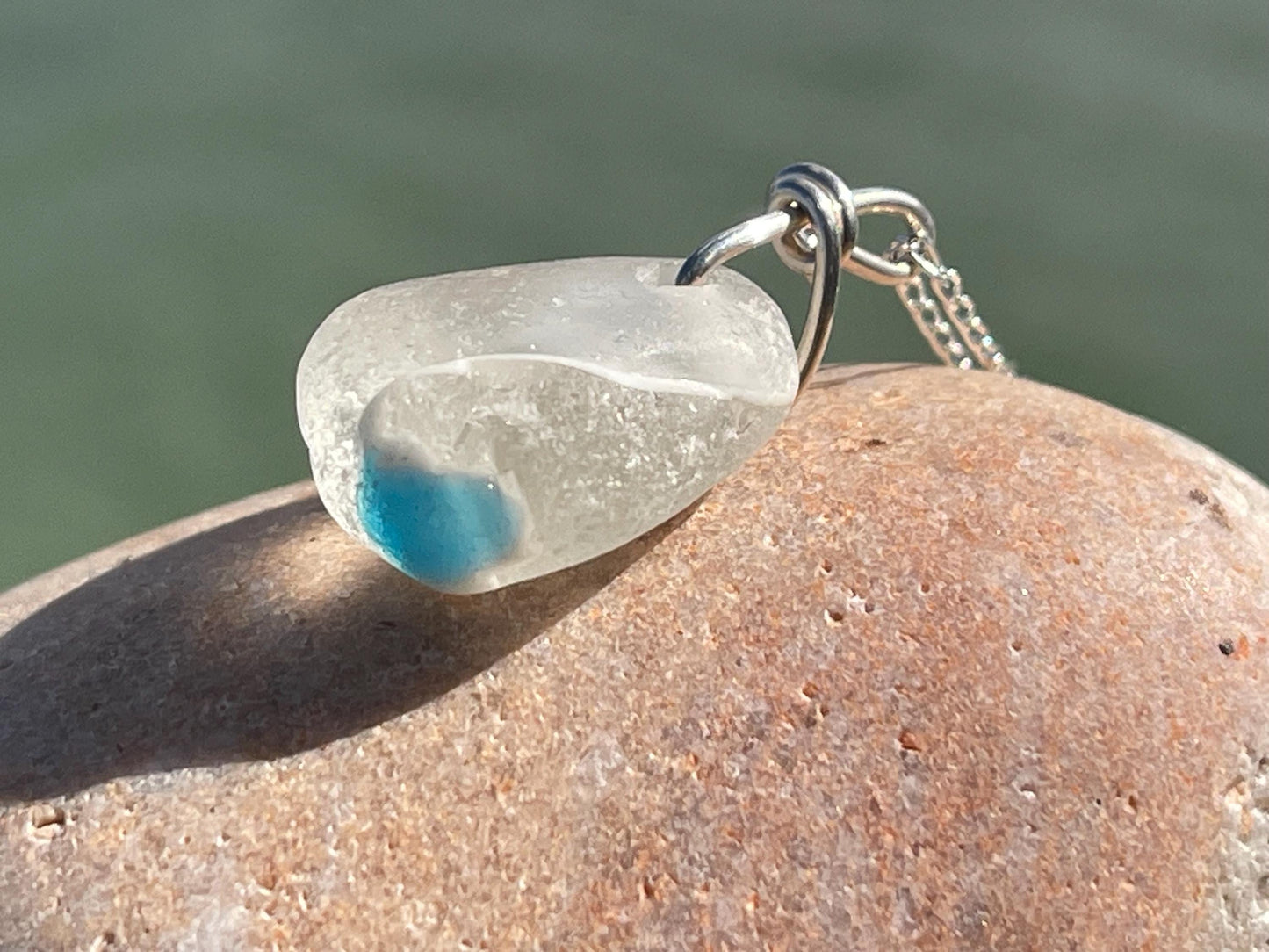 Eco friendly sea glass necklace on a sterling silver chain showcasing a little octopus. Octopus pendant, octopus necklace, ethical jewellery