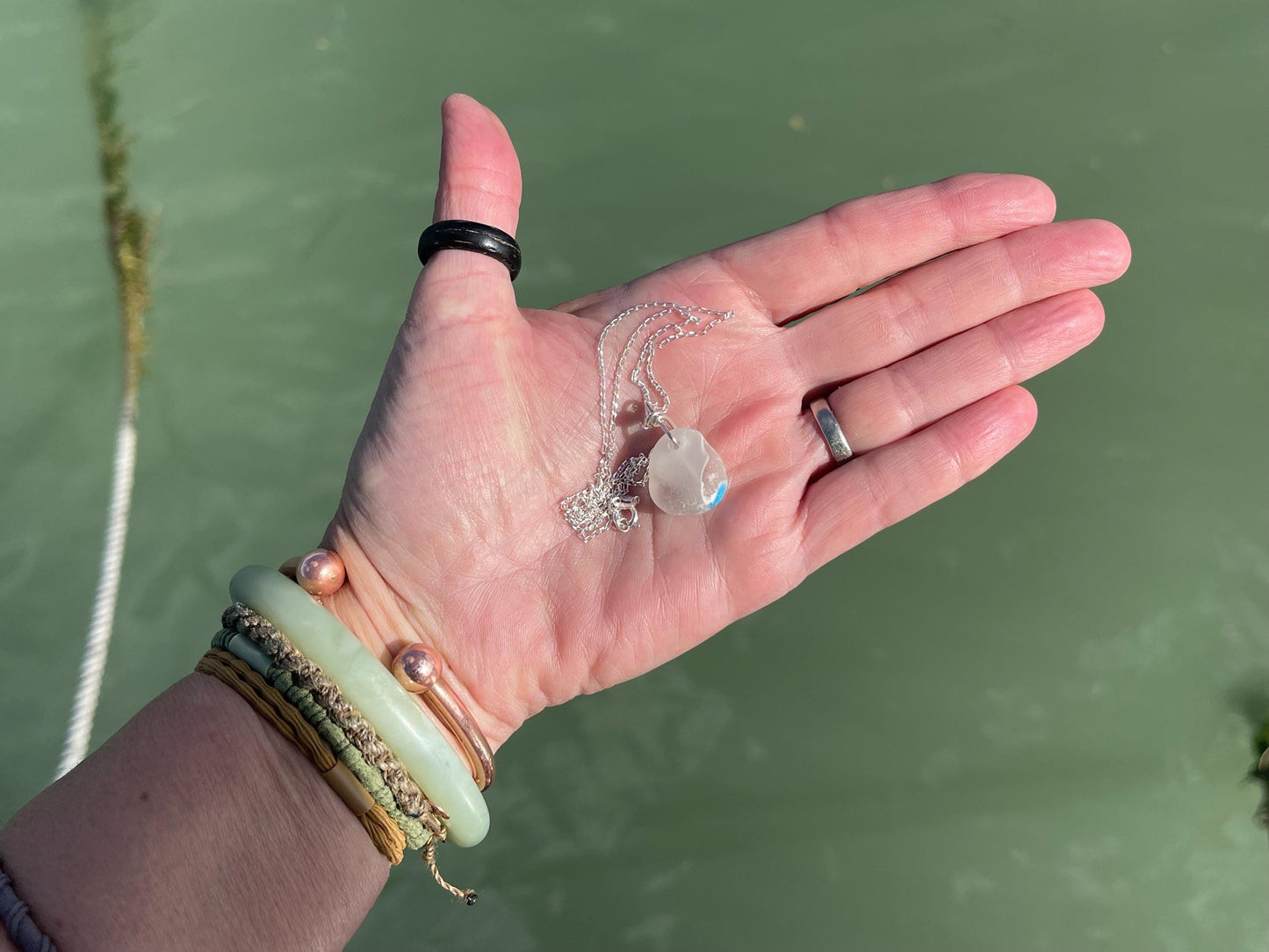 Eco friendly sea glass necklace on a sterling silver chain showcasing a little octopus. Octopus pendant, octopus necklace, ethical jewellery