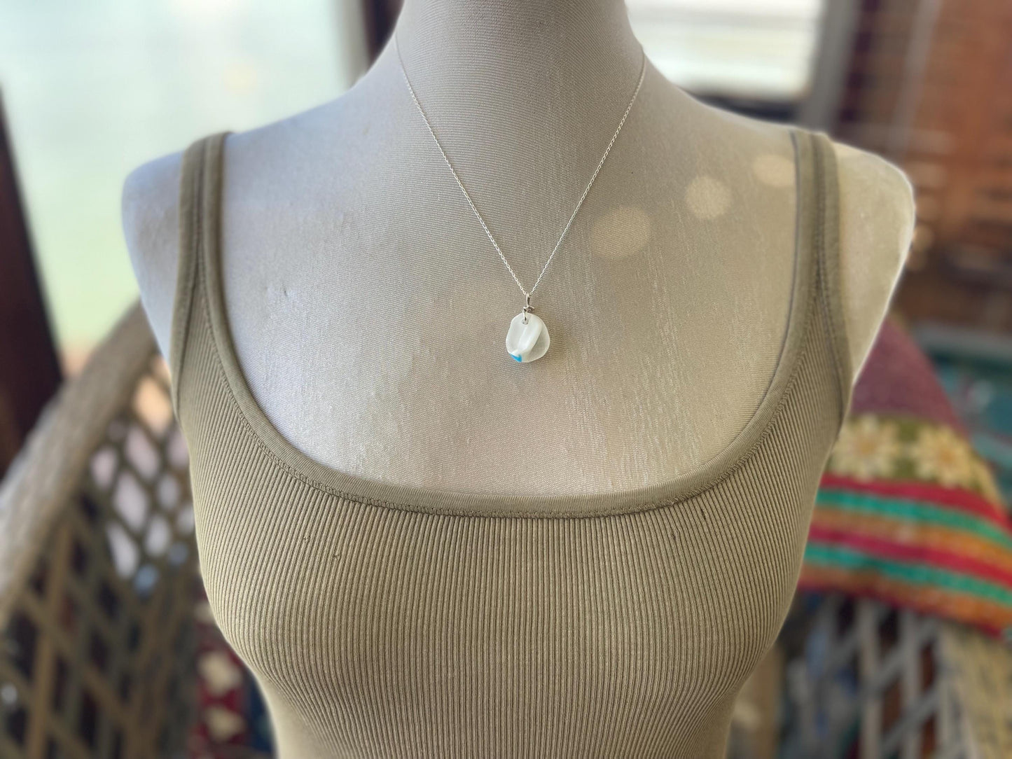 Eco friendly sea glass necklace on a sterling silver chain showcasing a little octopus. Octopus pendant, octopus necklace, ethical jewellery