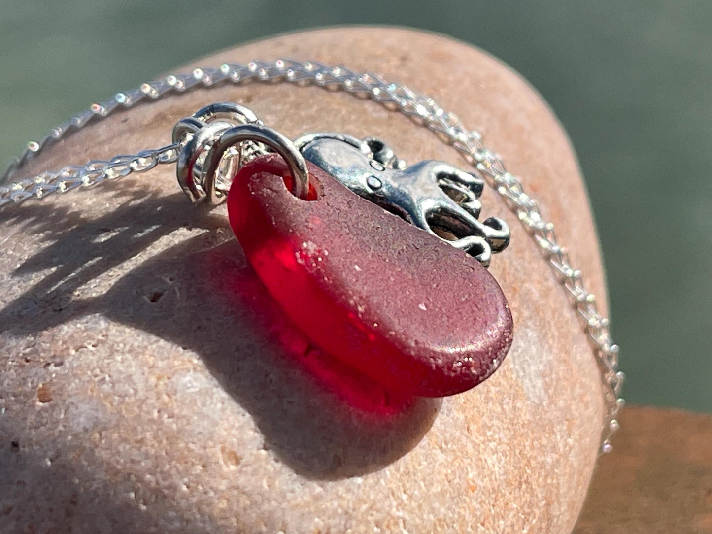 Eco friendly sea glass necklace on a sterling silver chain showcasing a little octopus. Octopus pendant, octopus necklace, ethical jewellery