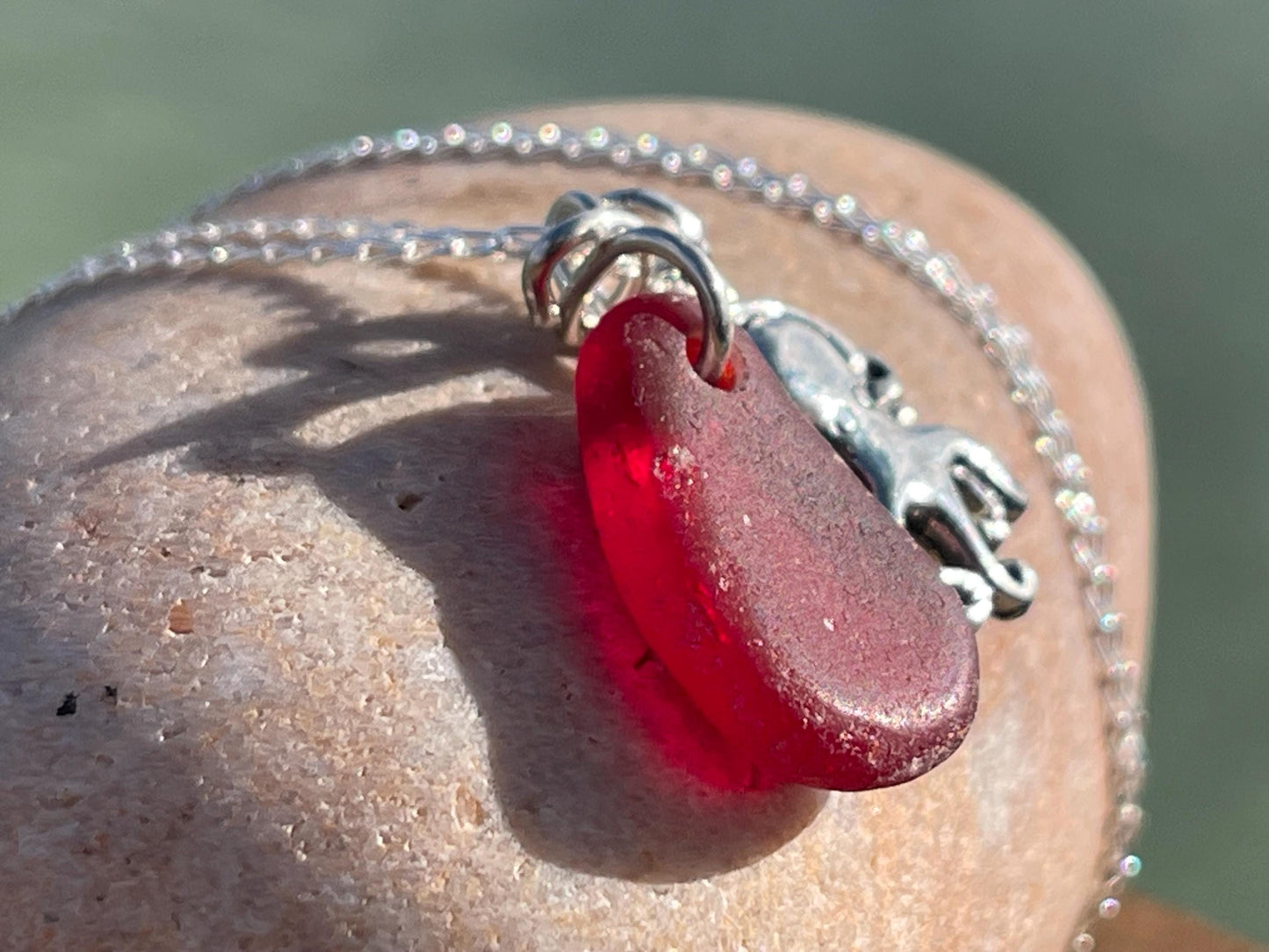 Eco friendly sea glass necklace on a sterling silver chain showcasing a little octopus. Octopus pendant, octopus necklace, ethical jewellery
