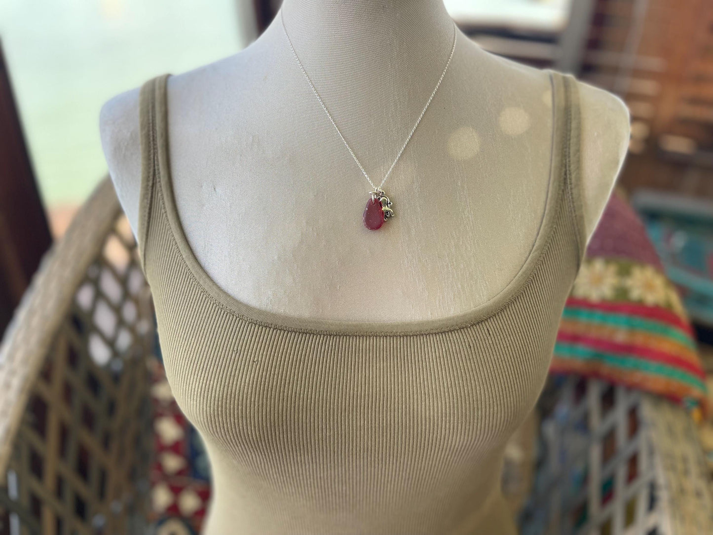 Eco friendly sea glass necklace on a sterling silver chain showcasing a little octopus. Octopus pendant, octopus necklace, ethical jewellery