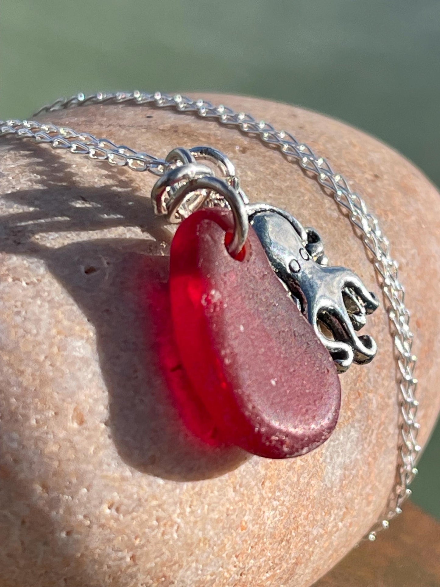 Eco friendly sea glass necklace on a sterling silver chain showcasing a little octopus. Octopus pendant, octopus necklace, ethical jewellery