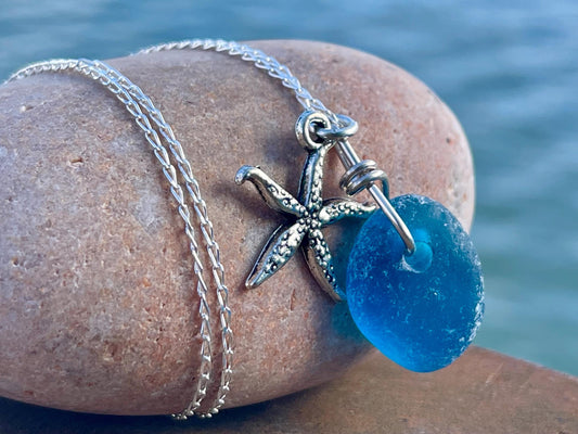 Eco friendly sea glass necklace on a sterling silver chain showcasing a little starfish. Starfish pendant, ethical jewellery. Sea swimming