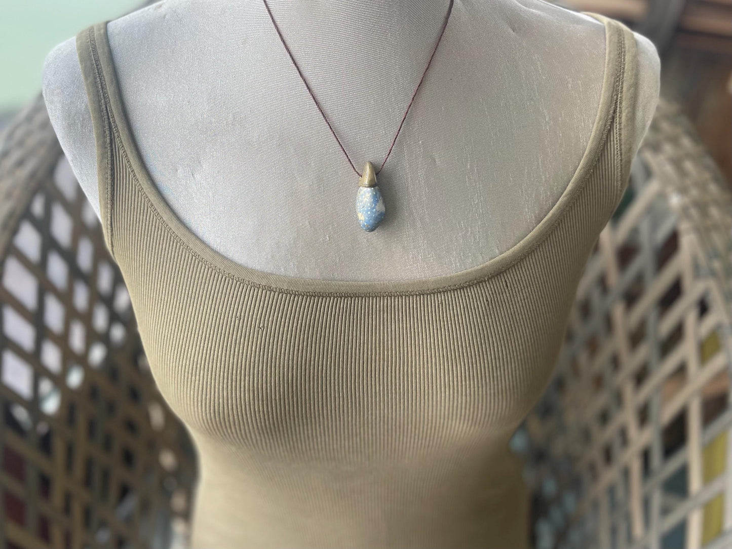 Pebble pendants. Painted pebble necklaces. Hand painted eco friendly necklaces. Eco friendly jewellery. Ethical handmade jewellery.