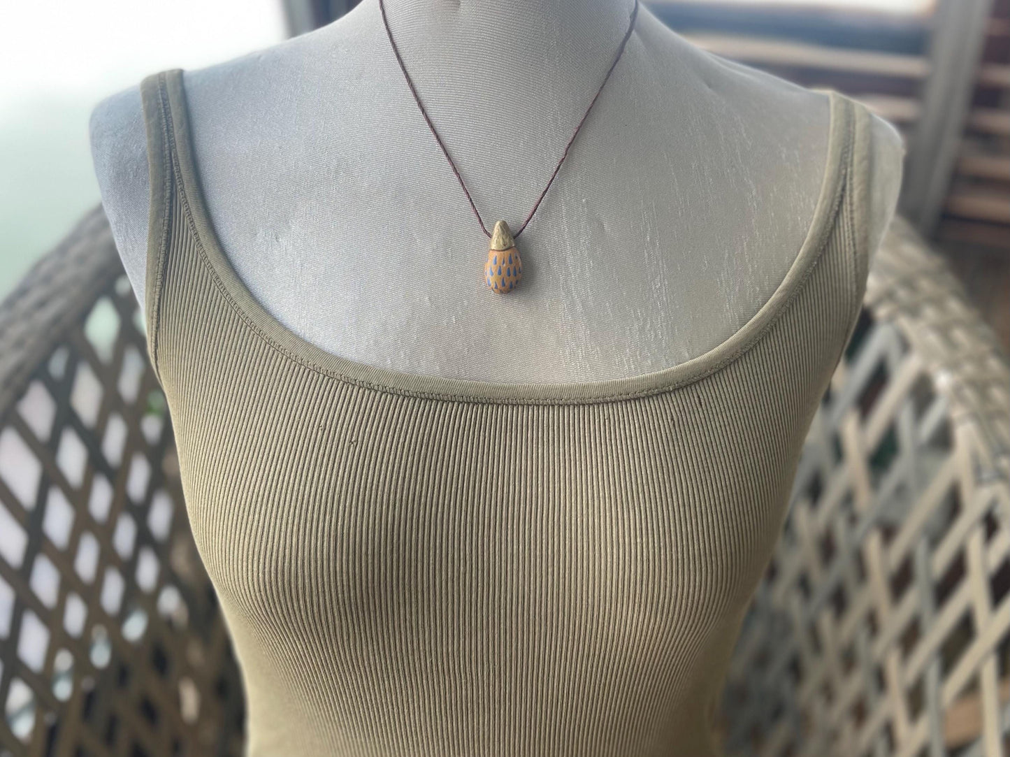 Pebble pendants. Painted pebble necklaces. Hand painted eco friendly necklaces. Eco friendly jewellery. Ethical handmade jewellery.