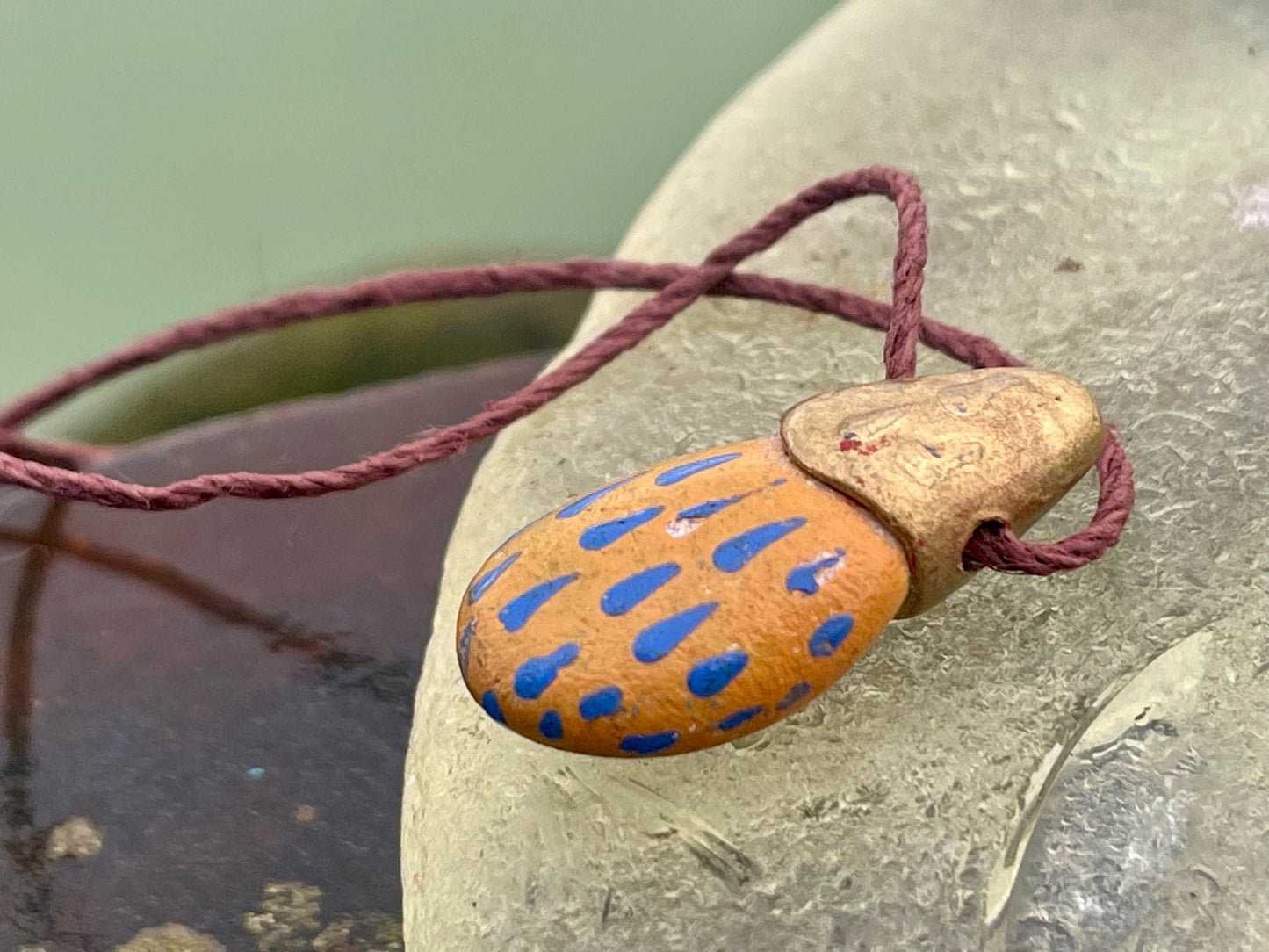 Pebble pendants. Painted pebble necklaces. Hand painted eco friendly necklaces. Eco friendly jewellery. Ethical handmade jewellery.