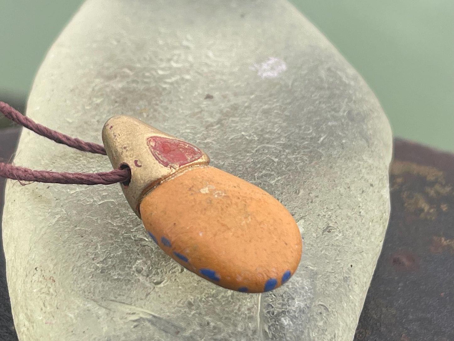 Pebble pendants. Painted pebble necklaces. Hand painted eco friendly necklaces. Eco friendly jewellery. Ethical handmade jewellery.