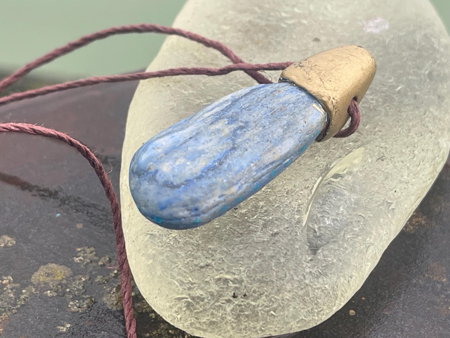 Pebble pendants. Painted pebble necklaces. Hand painted eco friendly necklaces. Eco friendly jewellery. Ethical handmade jewellery.