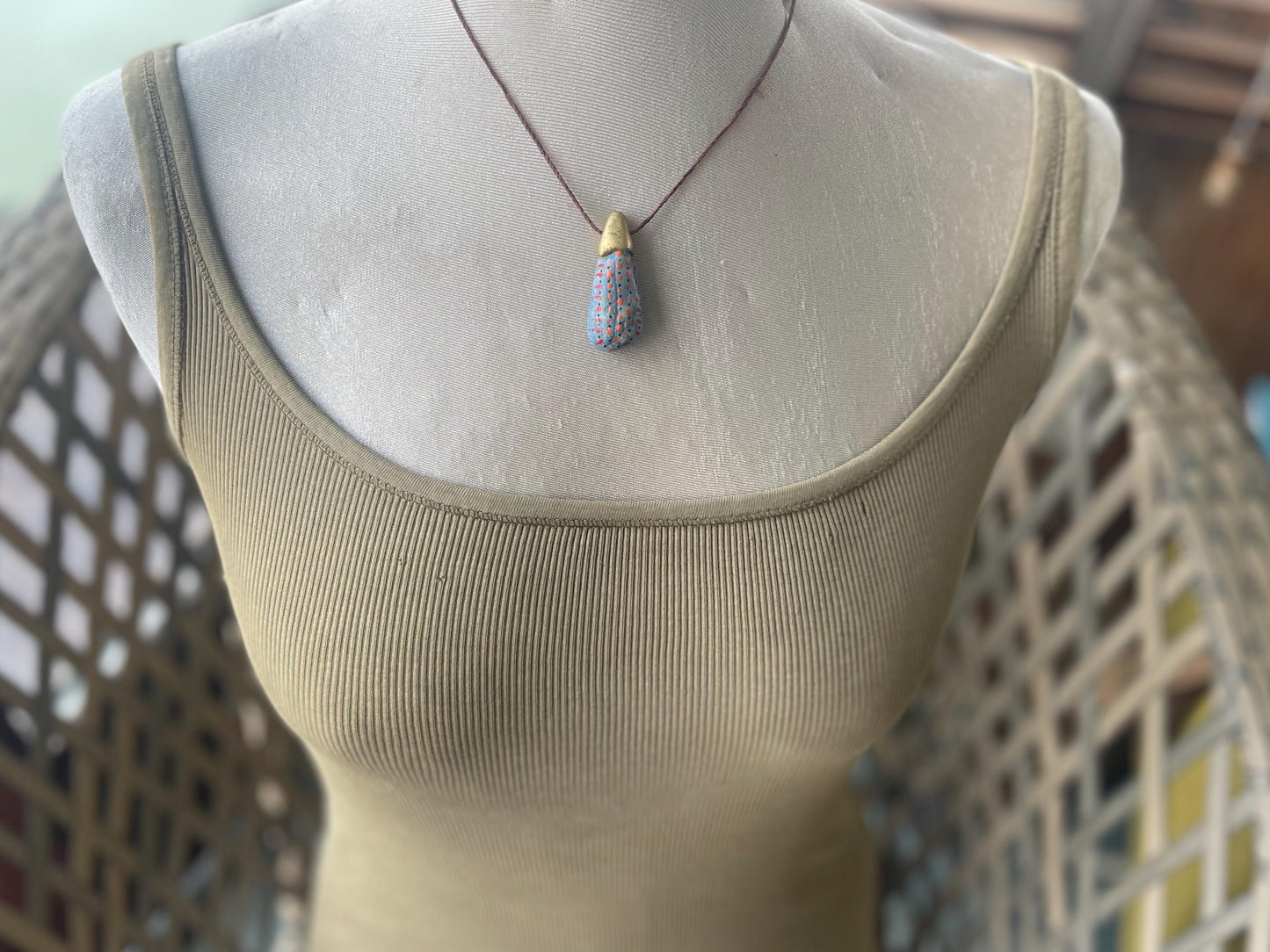 Pebble pendants. Painted pebble necklaces. Hand painted eco friendly necklaces. Eco friendly jewellery. Ethical handmade jewellery.