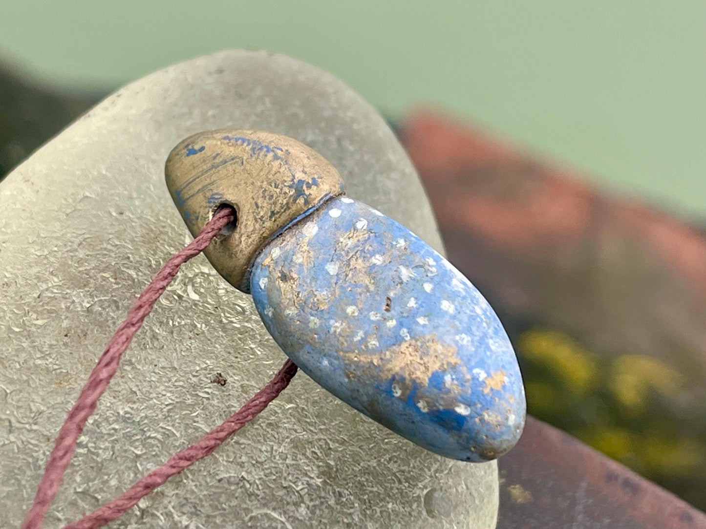 Pebble pendants. Painted pebble necklaces. Hand painted eco friendly necklaces. Eco friendly jewellery. Ethical handmade jewellery.