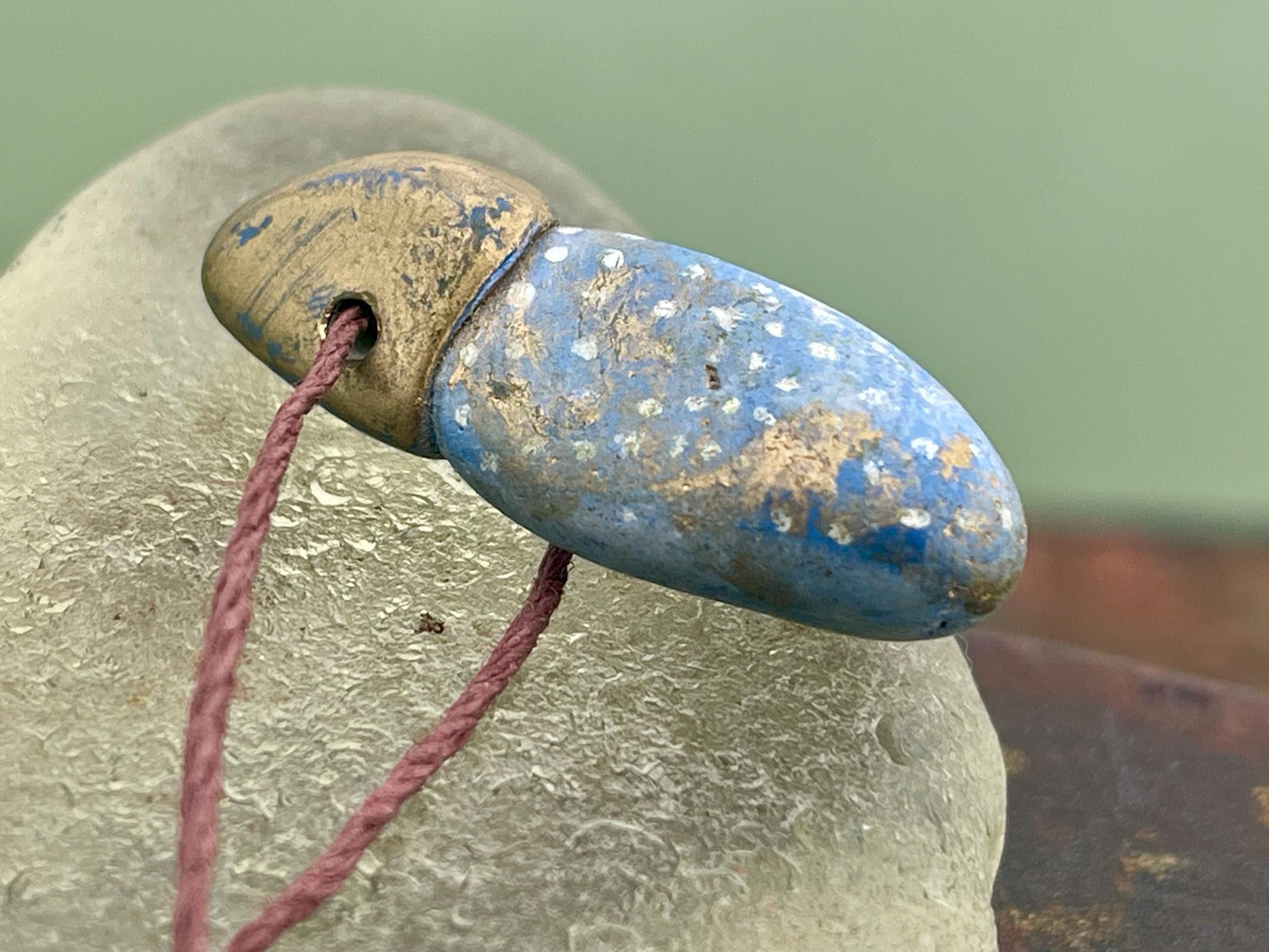 Pebble pendants. Painted pebble necklaces. Hand painted eco friendly necklaces. Eco friendly jewellery. Ethical handmade jewellery.