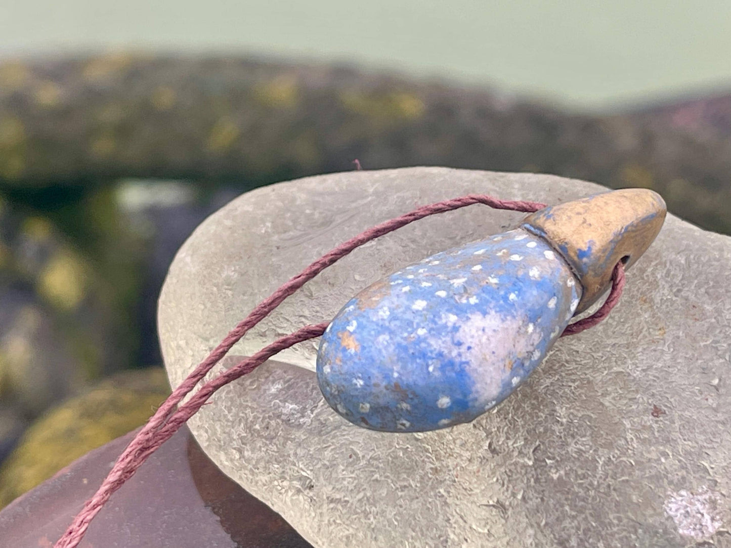 Pebble pendants. Painted pebble necklaces. Hand painted eco friendly necklaces. Eco friendly jewellery. Ethical handmade jewellery.