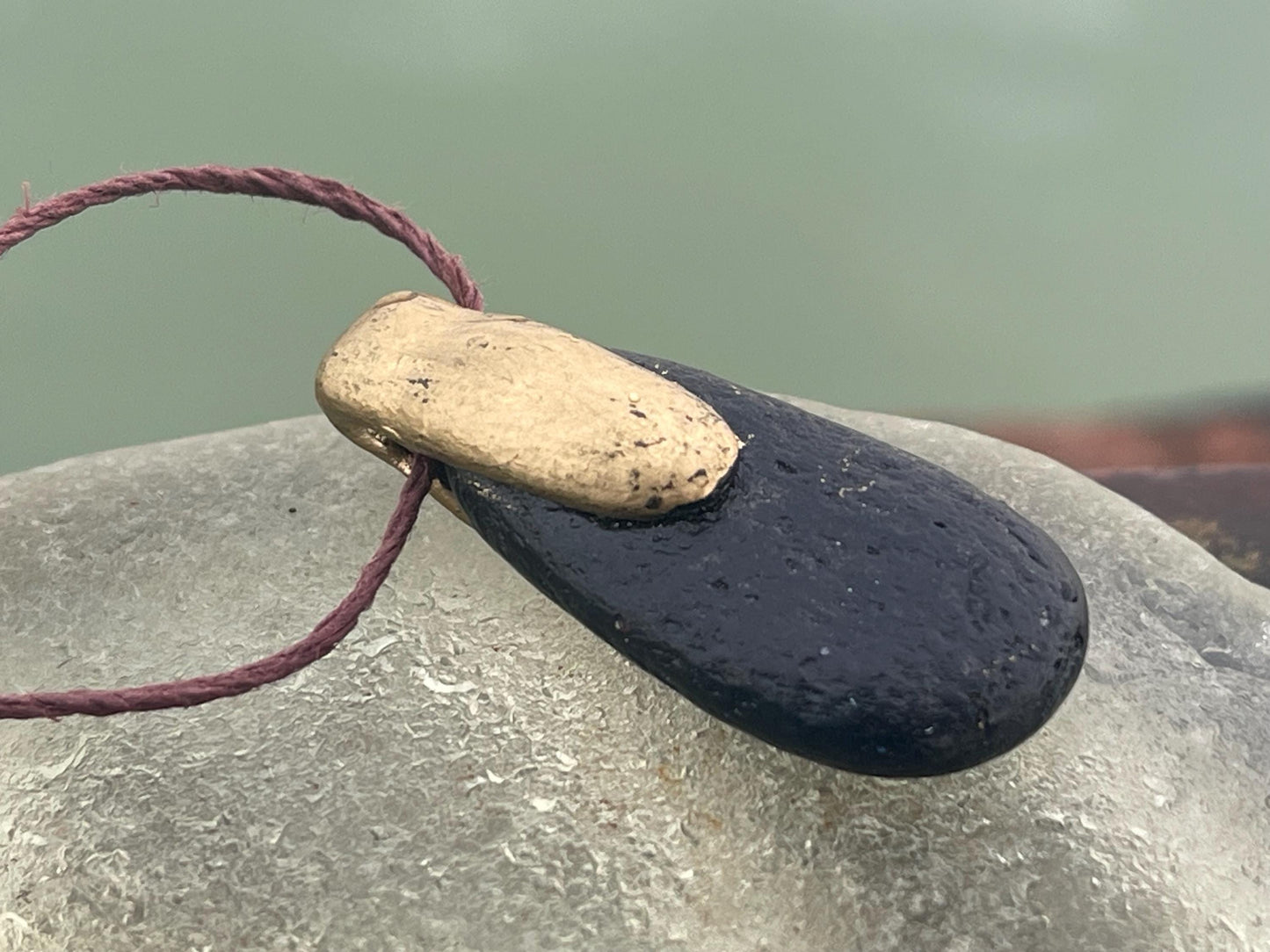 Pebble pendants. Painted pebble necklaces. Hand painted eco friendly necklaces. Eco friendly jewellery. Ethical handmade jewellery.