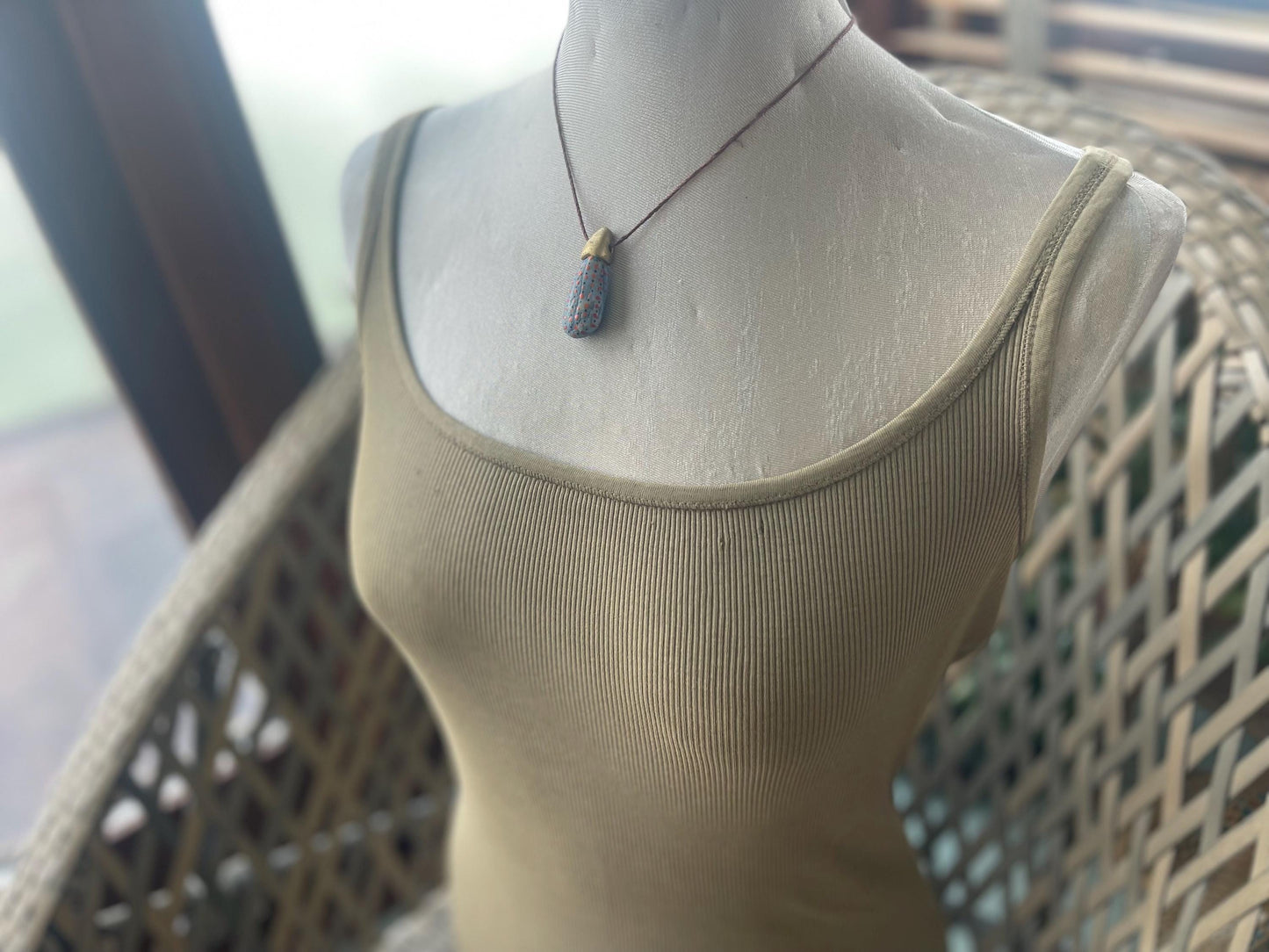 Pebble pendants. Painted pebble necklaces. Hand painted eco friendly necklaces. Eco friendly jewellery. Ethical handmade jewellery.