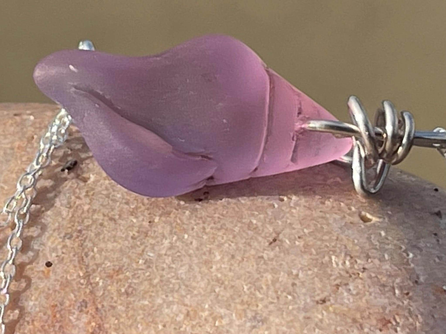 Eco friendly glass necklace on a sterling silver chain showcasing a pink shell pendant. Eco friendly jewellery. Ethical handmade jewellery