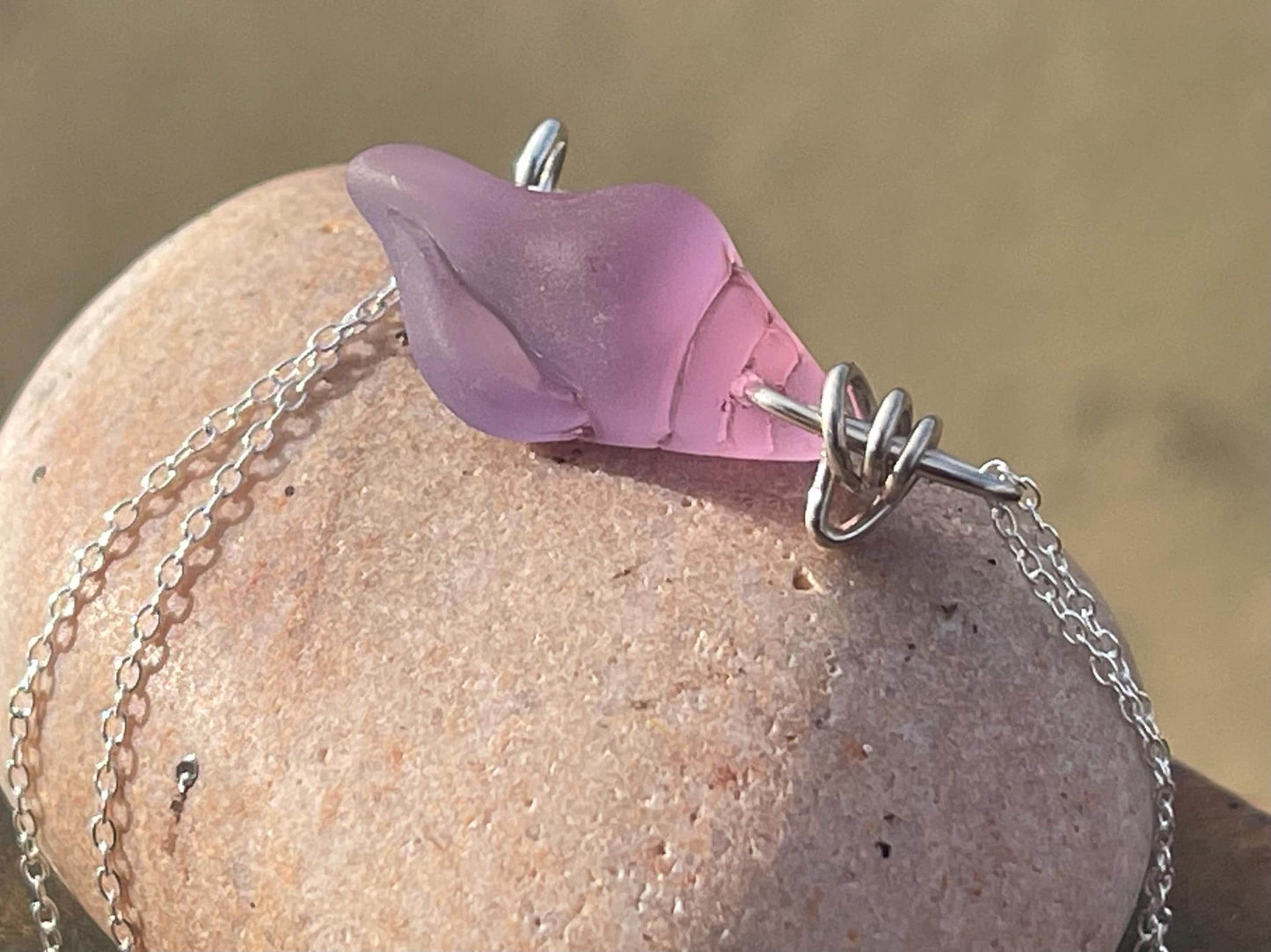 Eco friendly glass necklace on a sterling silver chain showcasing a pink shell pendant. Eco friendly jewellery. Ethical handmade jewellery