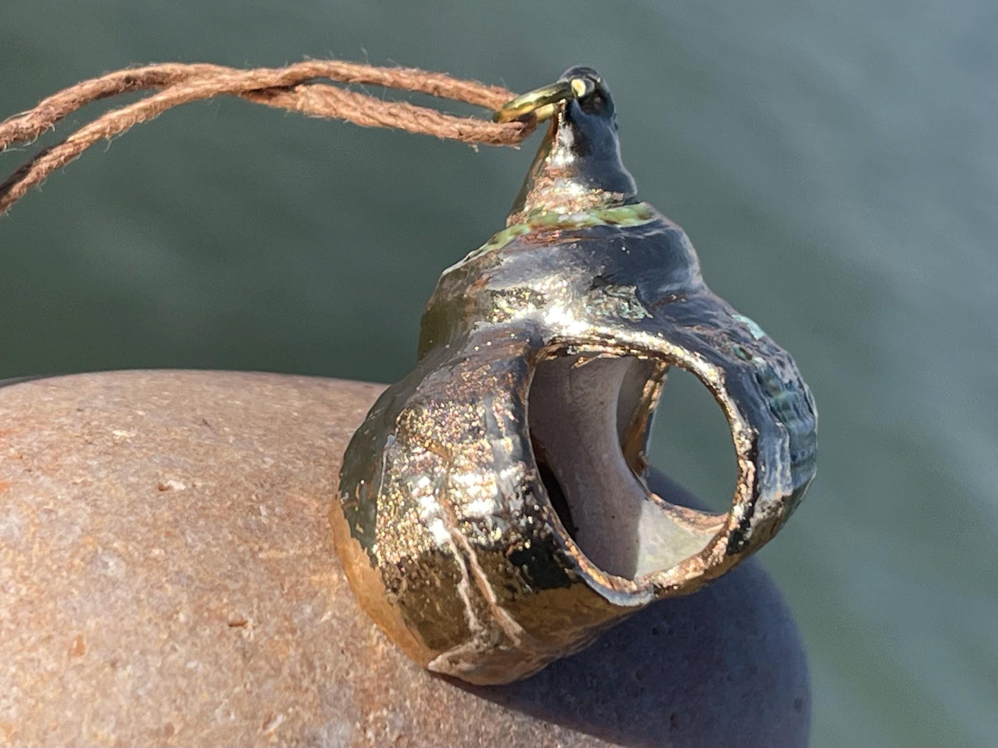 Large painted gold shell necklace held on recycled brass and sustainable hemp. Shell jewellery. Boho jewellery. Eco friendly gifts.