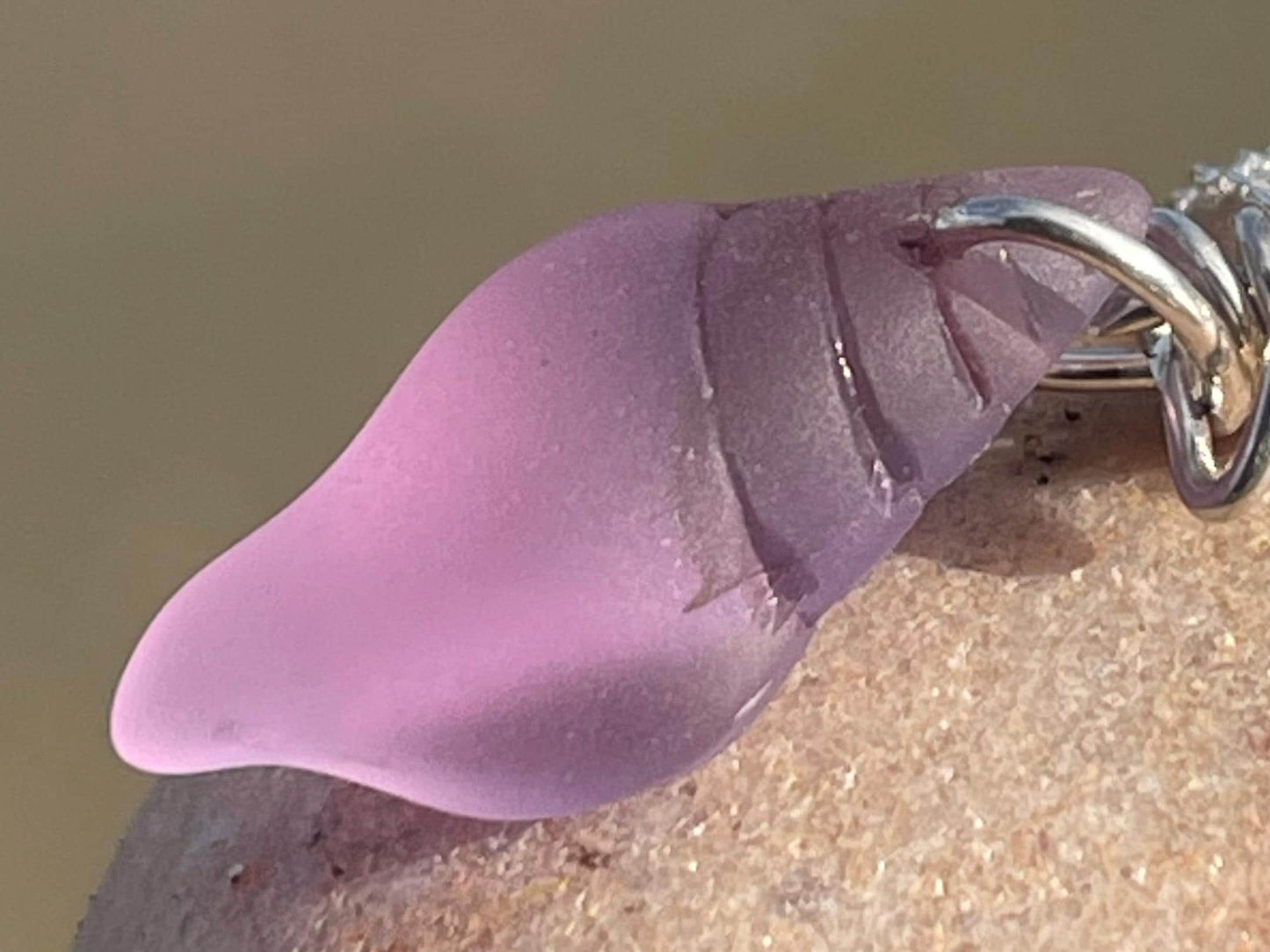 Eco friendly glass necklace on a sterling silver chain showcasing a pink shell pendant. Eco friendly jewellery. Ethical handmade jewellery