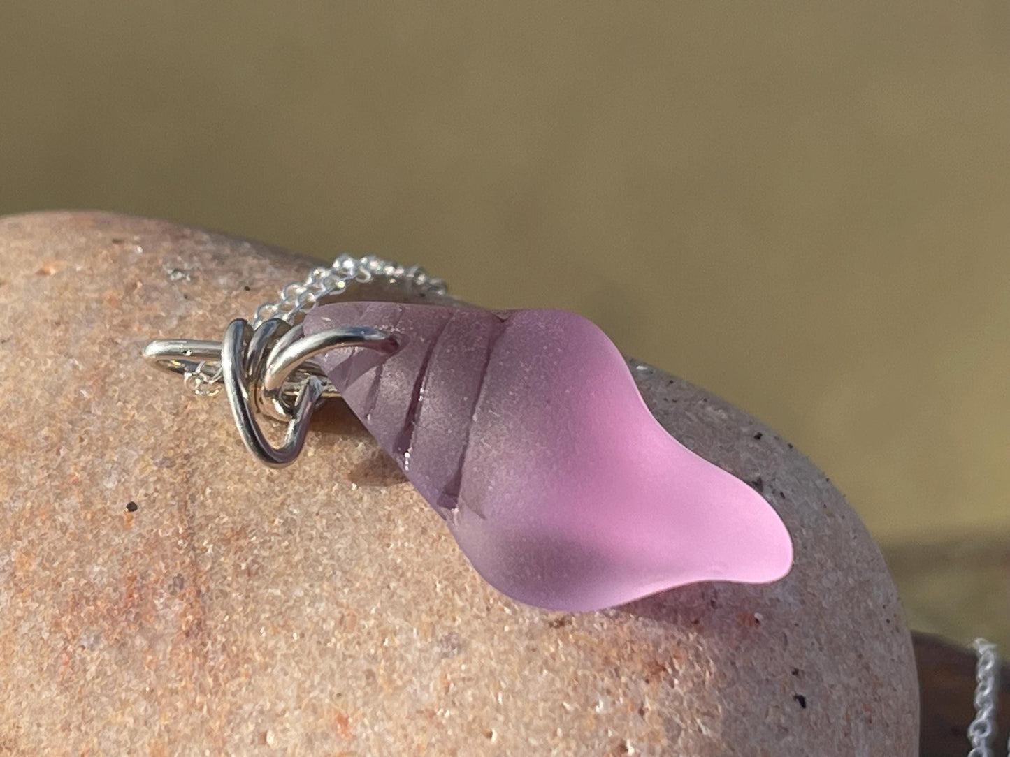 Eco friendly glass necklace on a sterling silver chain showcasing a pink shell pendant. Eco friendly jewellery. Ethical handmade jewellery