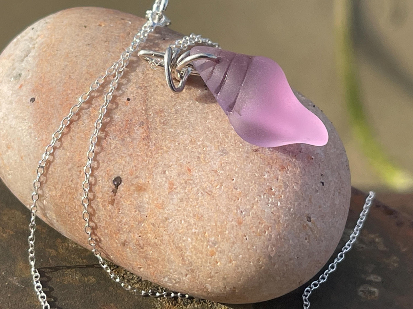 Eco friendly glass necklace on a sterling silver chain showcasing a pink shell pendant. Eco friendly jewellery. Ethical handmade jewellery