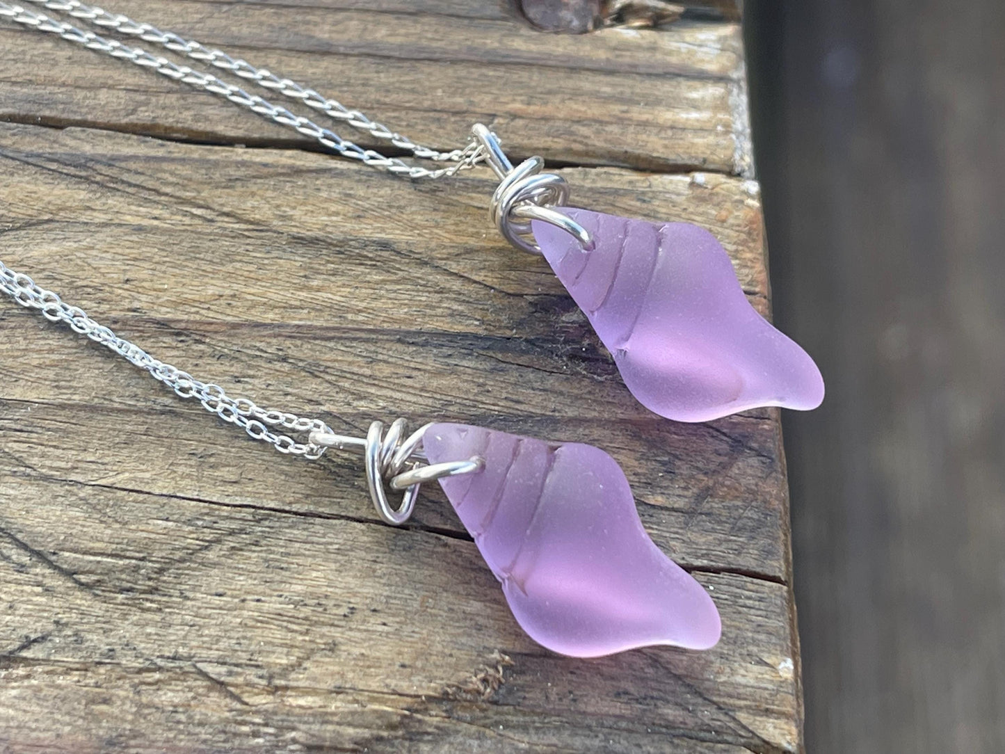 Eco friendly glass necklace on a sterling silver chain showcasing a pink shell pendant. Eco friendly jewellery. Ethical handmade jewellery