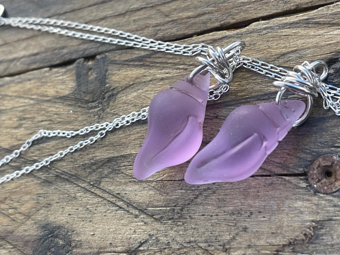 Eco friendly glass necklace on a sterling silver chain showcasing a pink shell pendant. Eco friendly jewellery. Ethical handmade jewellery