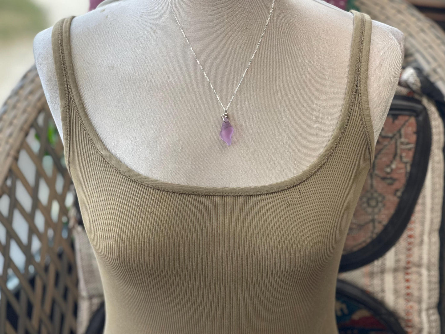 Eco friendly glass necklace on a sterling silver chain showcasing a pink shell pendant. Eco friendly jewellery. Ethical handmade jewellery