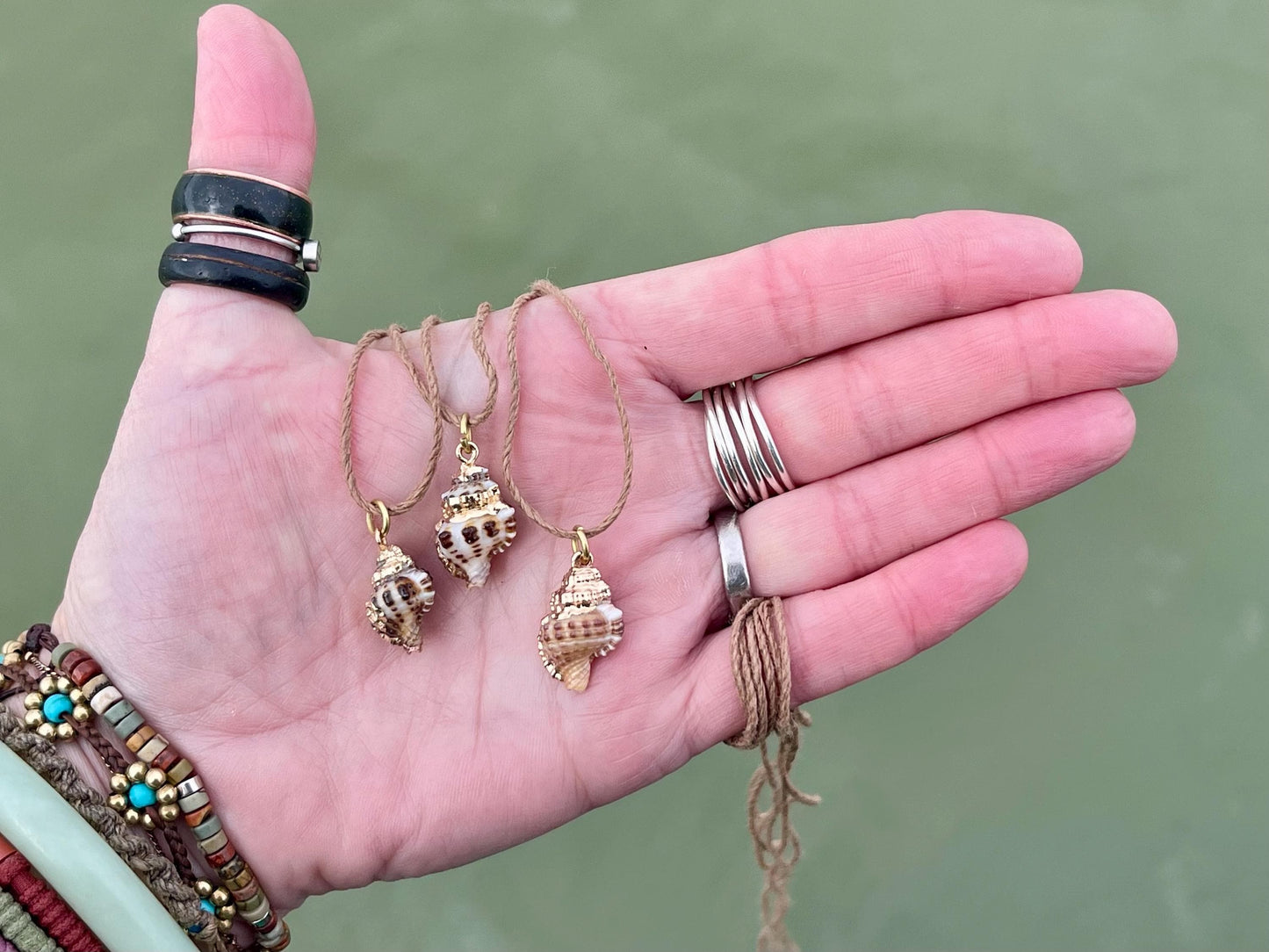 Pretty little painted gold shell necklace held on recycled brass and sustainable hemp. Shell jewellery. Boho jewellery. Eco friendly gifts.