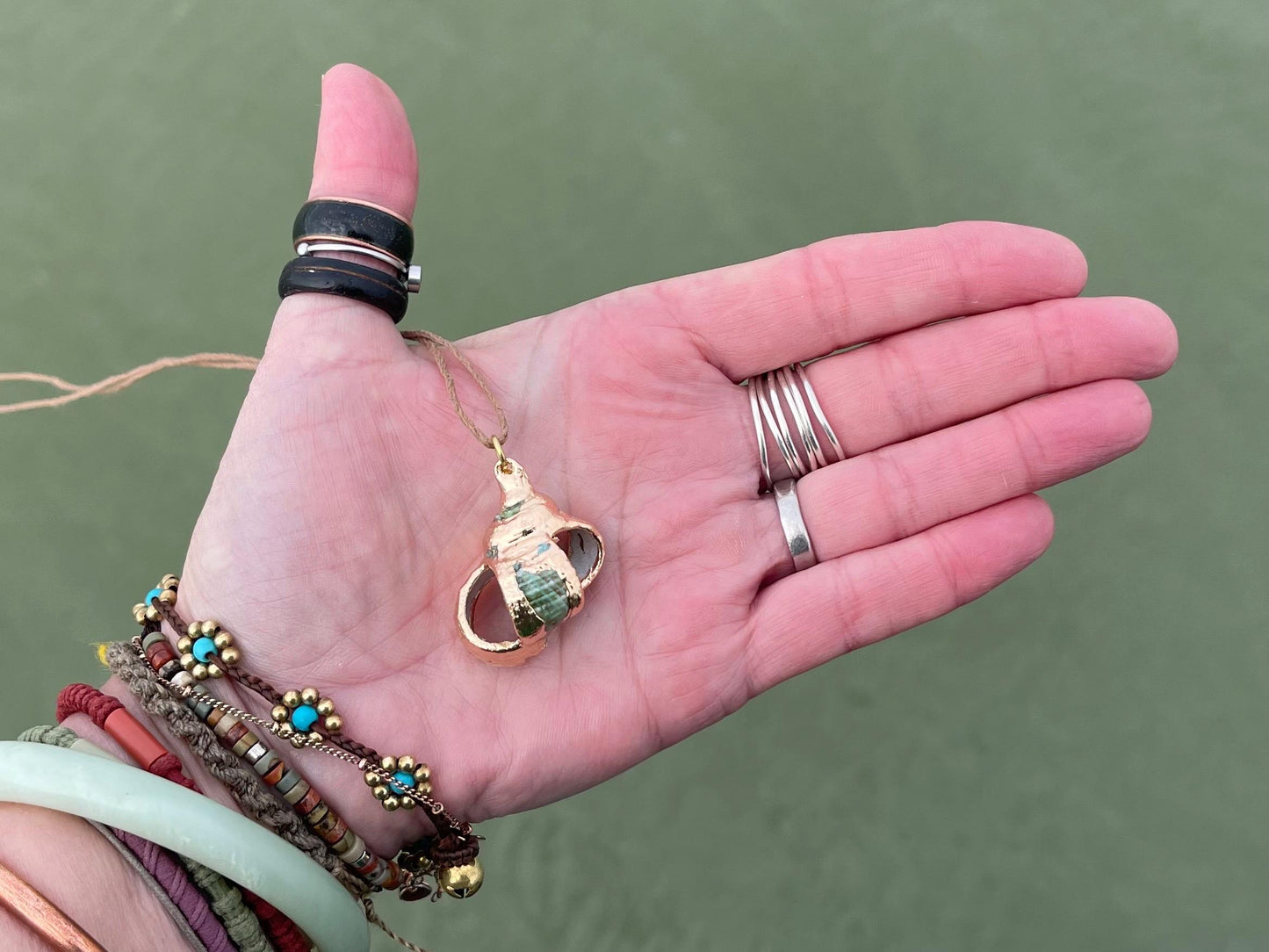 Large painted gold shell necklace held on recycled brass and sustainable hemp. Shell jewellery. Boho jewellery. Eco friendly gifts.