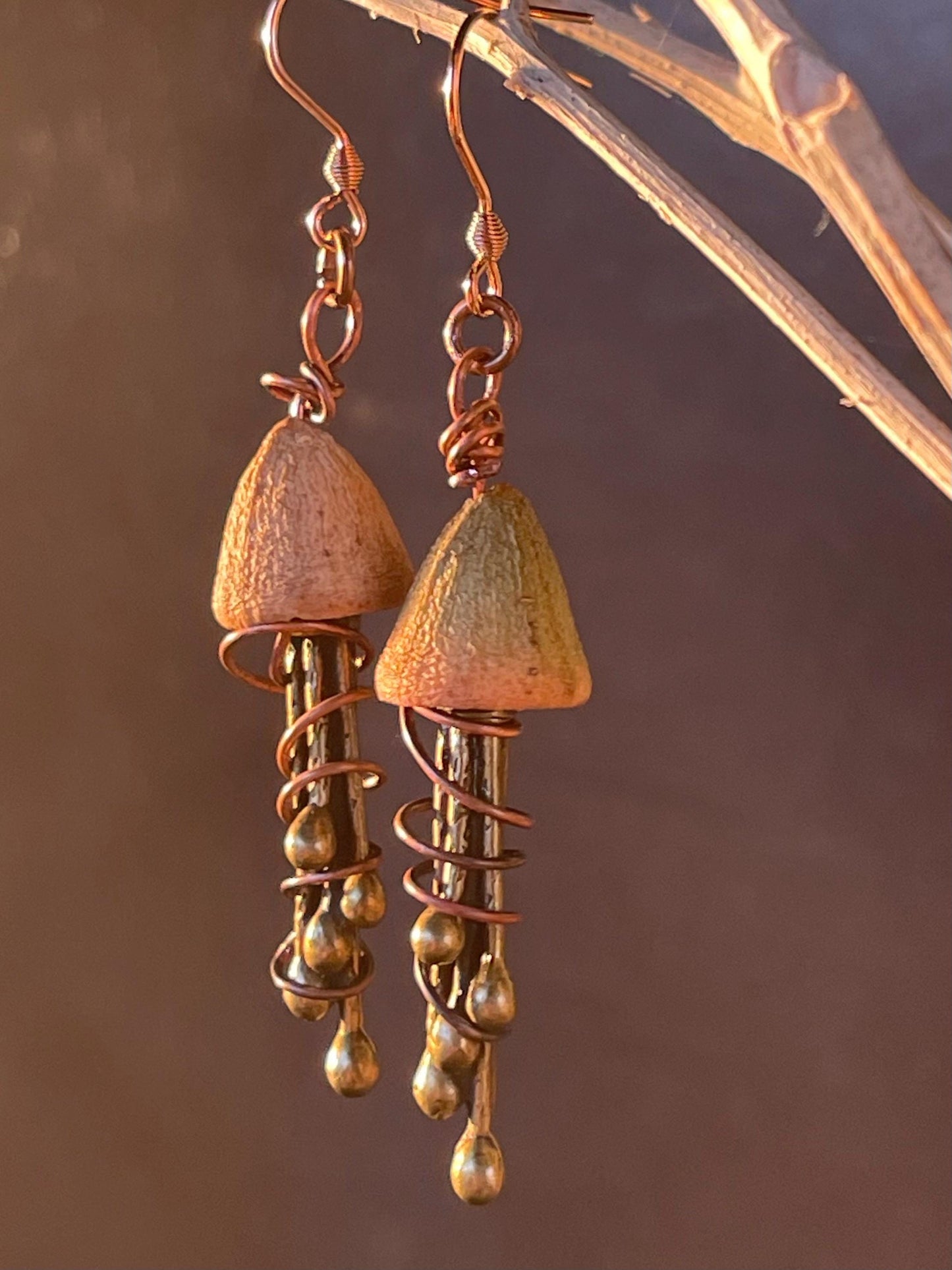 Jellyfish earrings made from recycled copper and eucalyptus seeds. Unique jellyfish jewellery. Handmade earrings. Eco friendly jewellery.