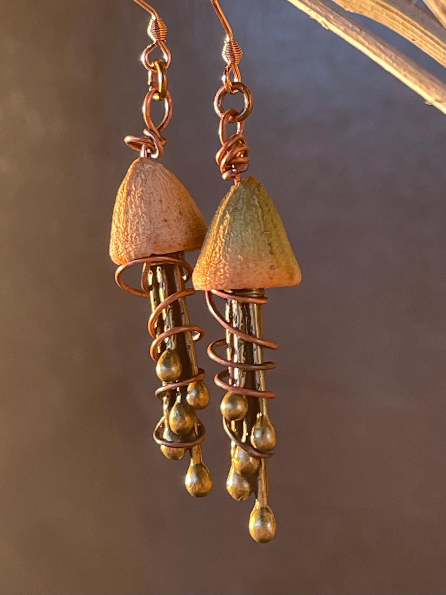 Jellyfish earrings made from recycled copper and eucalyptus seeds. Unique jellyfish jewellery. Handmade earrings. Eco friendly jewellery.