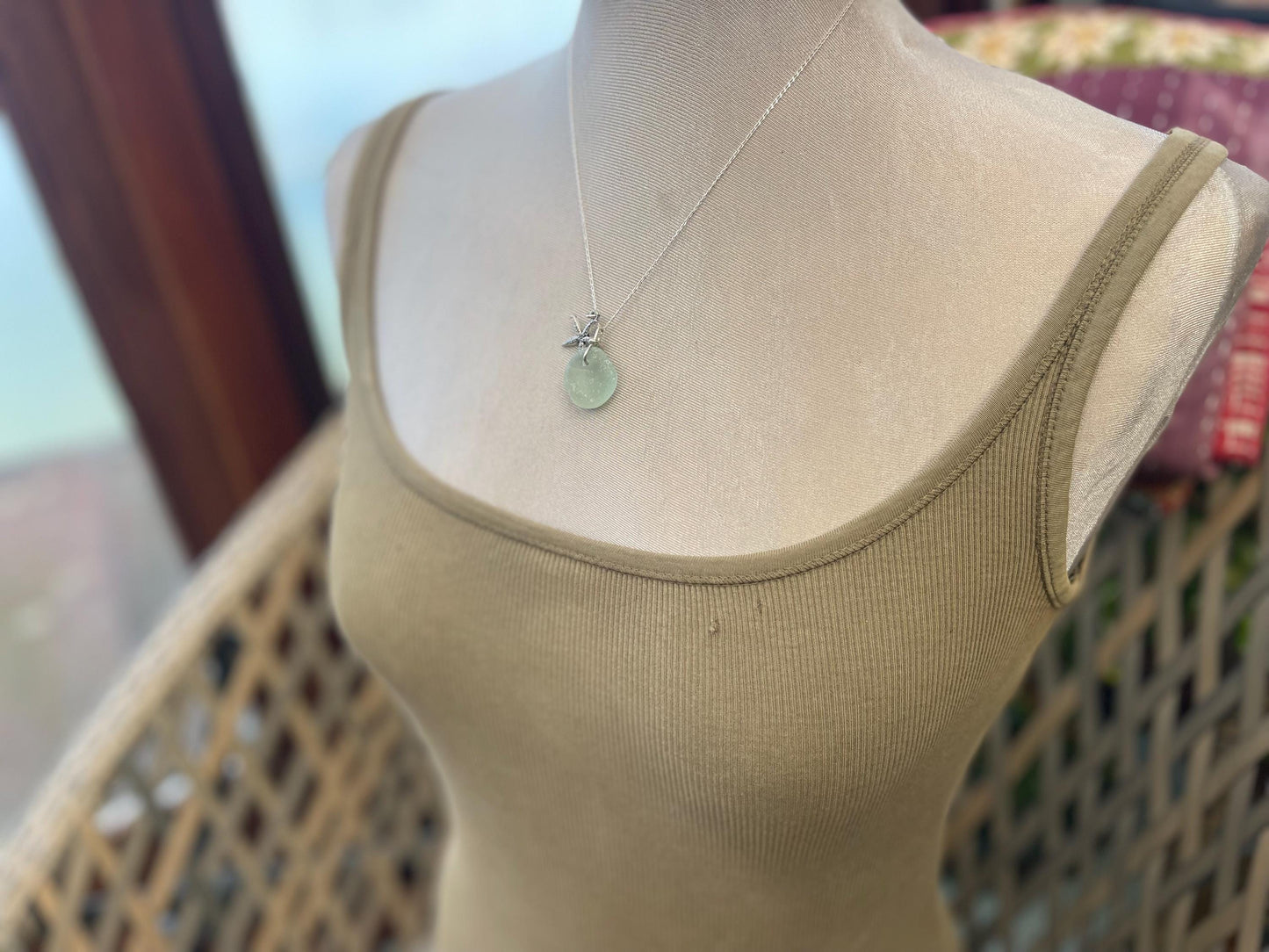 Eco friendly white sea glass necklace on a sterling silver chain showcasing a little starfish. Starfish pendant, eco friendly jewellery.