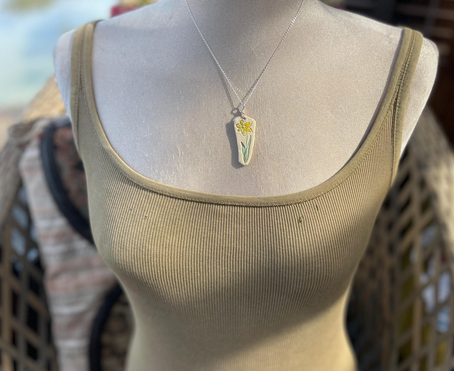 Handmade daffodil necklace. Eco friendly jewellery. Ethical pendants made with waste clay and recycled sterling silver. Ethical jewellery.