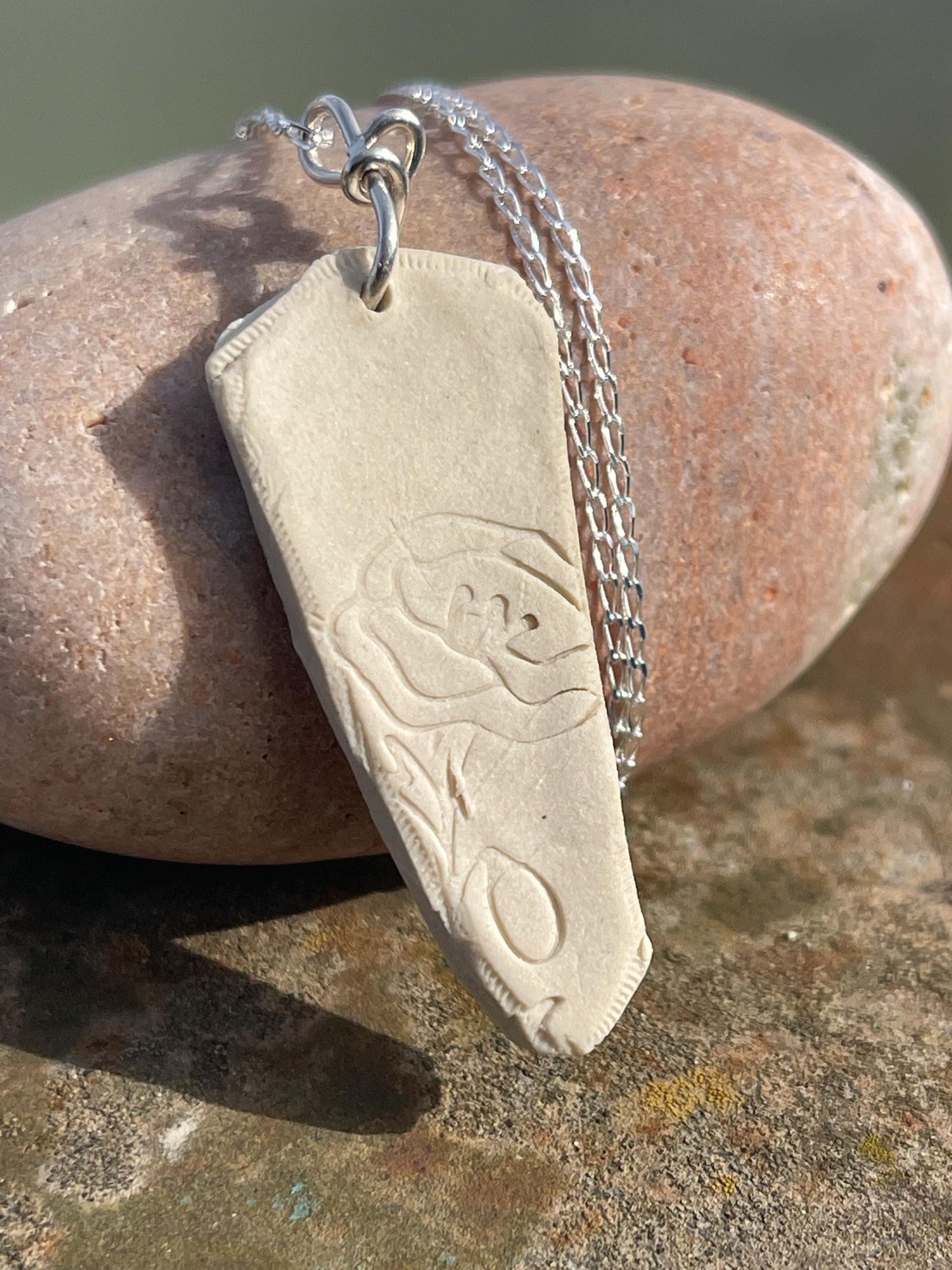 Handmade daffodil necklace. Eco friendly jewellery. Ethical pendants made with waste clay and recycled sterling silver. Ethical jewellery.