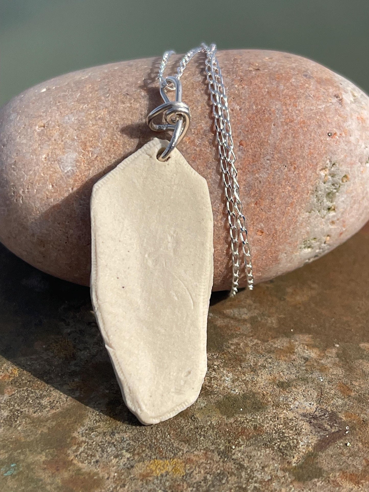 Handmade daisy necklace. Eco friendly jewellery. Ethical pendants made with waste clay and recycled sterling silver. Ethical jewellery.