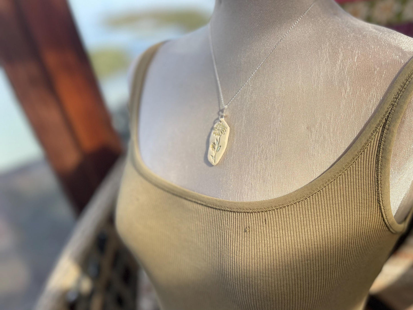 Handmade daisy necklace. Eco friendly jewellery. Ethical pendants made with waste clay and recycled sterling silver. Ethical jewellery.