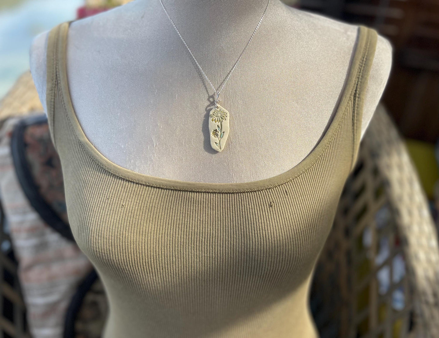 Handmade daisy necklace. Eco friendly jewellery. Ethical pendants made with waste clay and recycled sterling silver. Ethical jewellery.