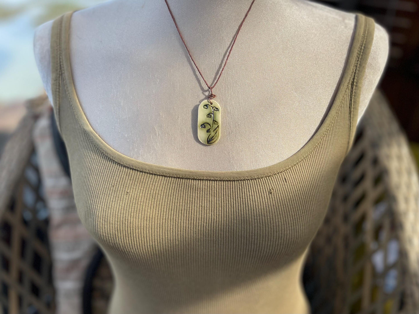 Handmade snowdrop necklace. Eco friendly jewellery. Ethical pendants made with waste clay and burnt recycled copper. Ethical jewellery.