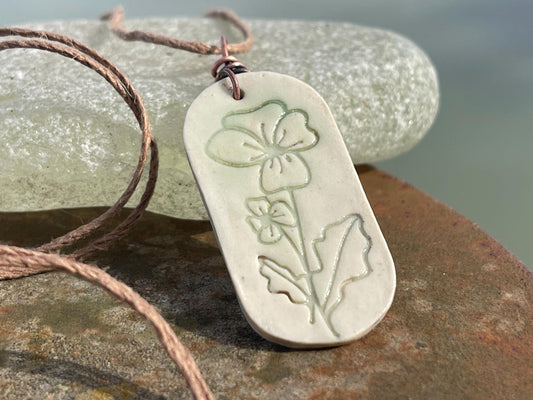 Handmade Poppy necklace. Eco friendly jewellery. Ethical pendants made with waste clay and burnt recycled copper. Ethical jewellery.