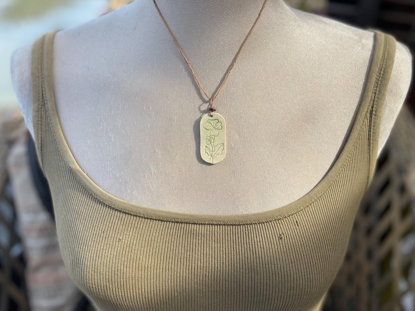 Handmade Poppy necklace. Eco friendly jewellery. Ethical pendants made with waste clay and burnt recycled copper. Ethical jewellery.